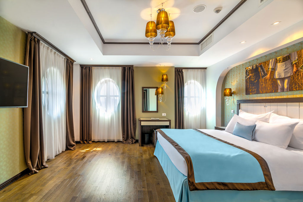 View of a bedroom in one of Hotel Epoque’s suites